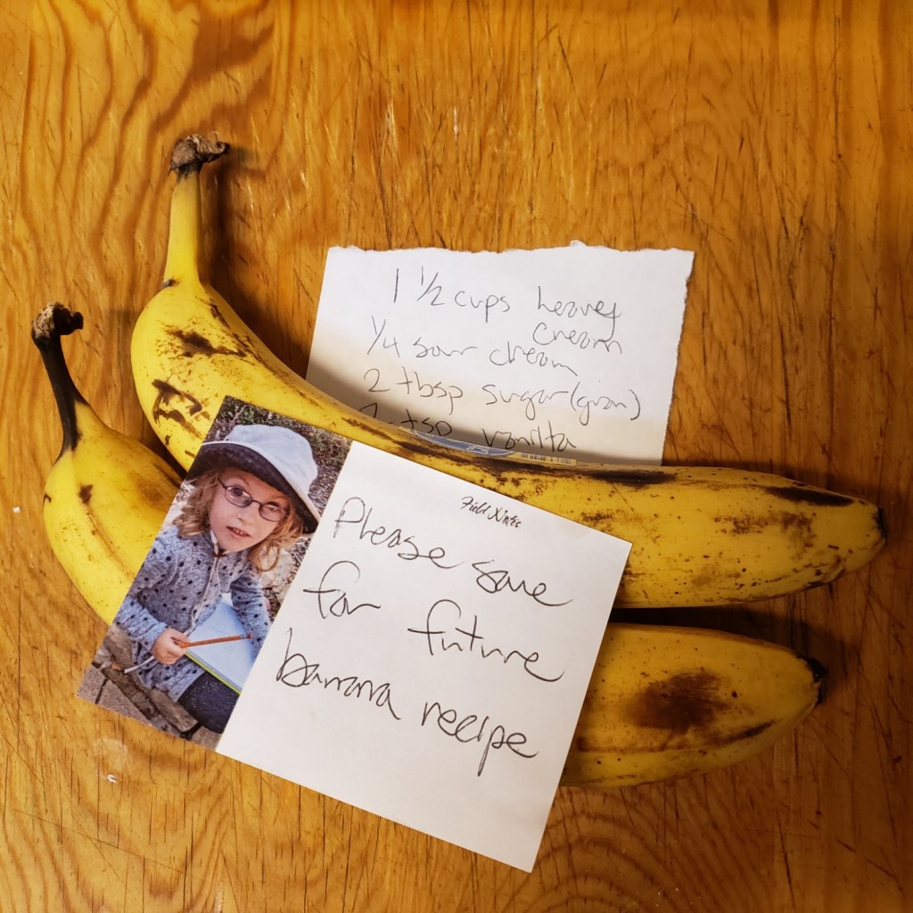 Two overripe bananas with a sticky note saying please save for future banana recipe
