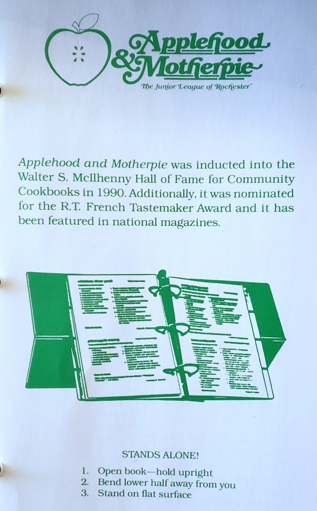 The title page of Applehood and Motherpie, with a blurb about a couple awards it's won. Also a diagram showing how the book with stand upright when you fold the cover as shown.