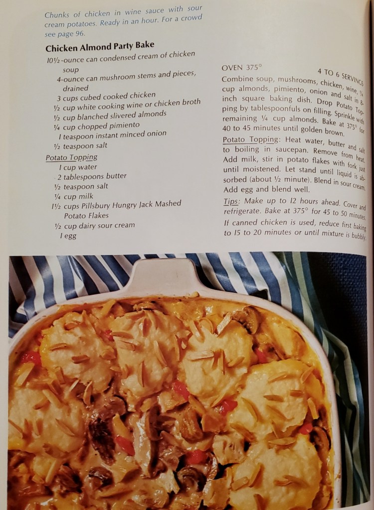 A recipe for Chicken Almond Party Bake, using condensed cream of chicken soup, mushrooms, cubed chicken, white wine, almonds, pimiento, with a sorta mashed potato topping.